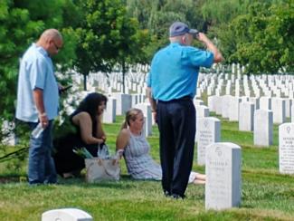 Kaelah Wallace and family at her Great Grandmother's grave